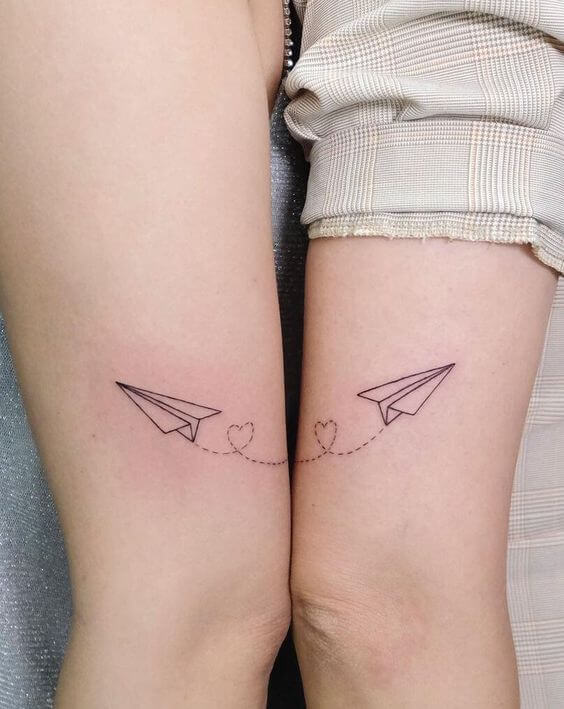Small matching tattoos for sisters