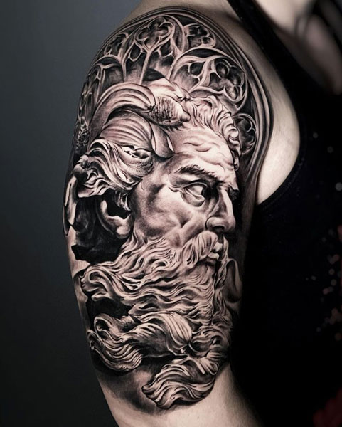 Portrait tattoo of Zeus with stylized background. Realistic black and gray tattoo.