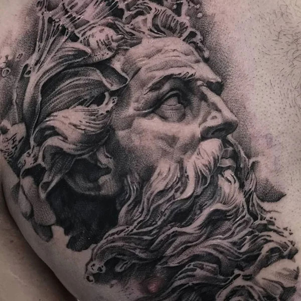 Close up shot of Zeus's face. Black and grey realism tattoo. 