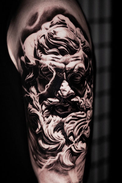 Scary tattoo of older Zeus.