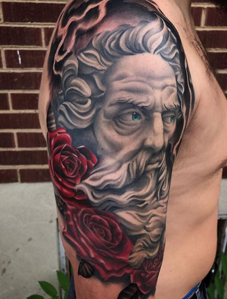 Zeus tattoo with colored roses. 