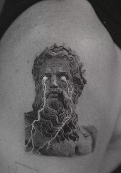 Stylish Zeus Tattoo with lightning coming out of his eye. Realism tattoo.