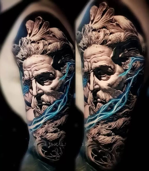 Very realistic Zeus tattoo where he is made out of marble in black and gray tattoo style. Blue lightning bolt going around Zeus's face.