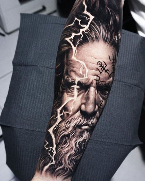Viking like portrait of Zeus with lightning. Vlogigurl tattoo.
