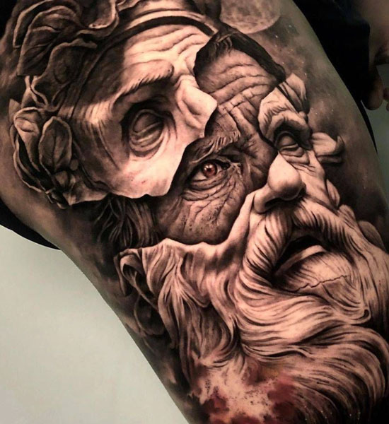 Hyper realistic tattoo of the Greek god Zeus where his real face is breaking out of a marble mold. 