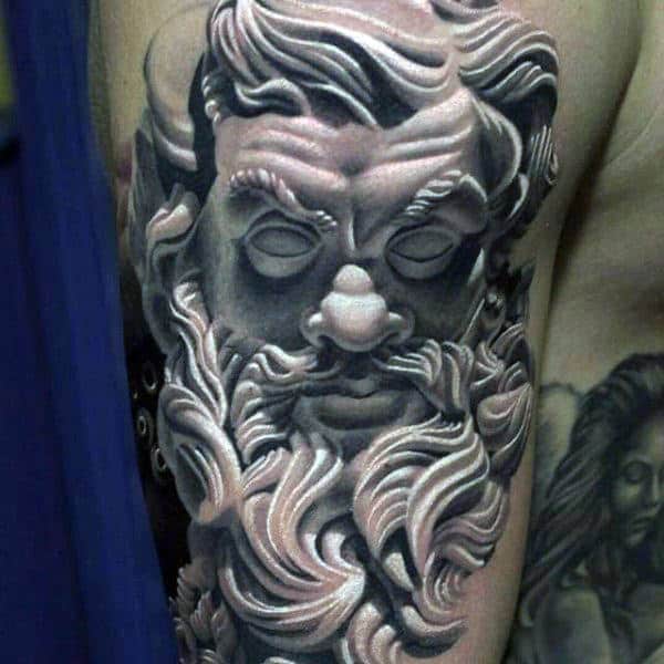 Marble face of Zeus tattoo.