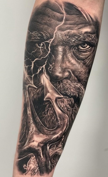Hyper realistic Zeus tattoo with lightning and Zeus holding the trident. 